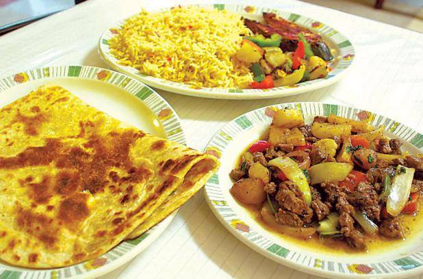 Djiboutian rice bariis and fish kalluun Liver beerka with vegetable also Sabaayad pancakes